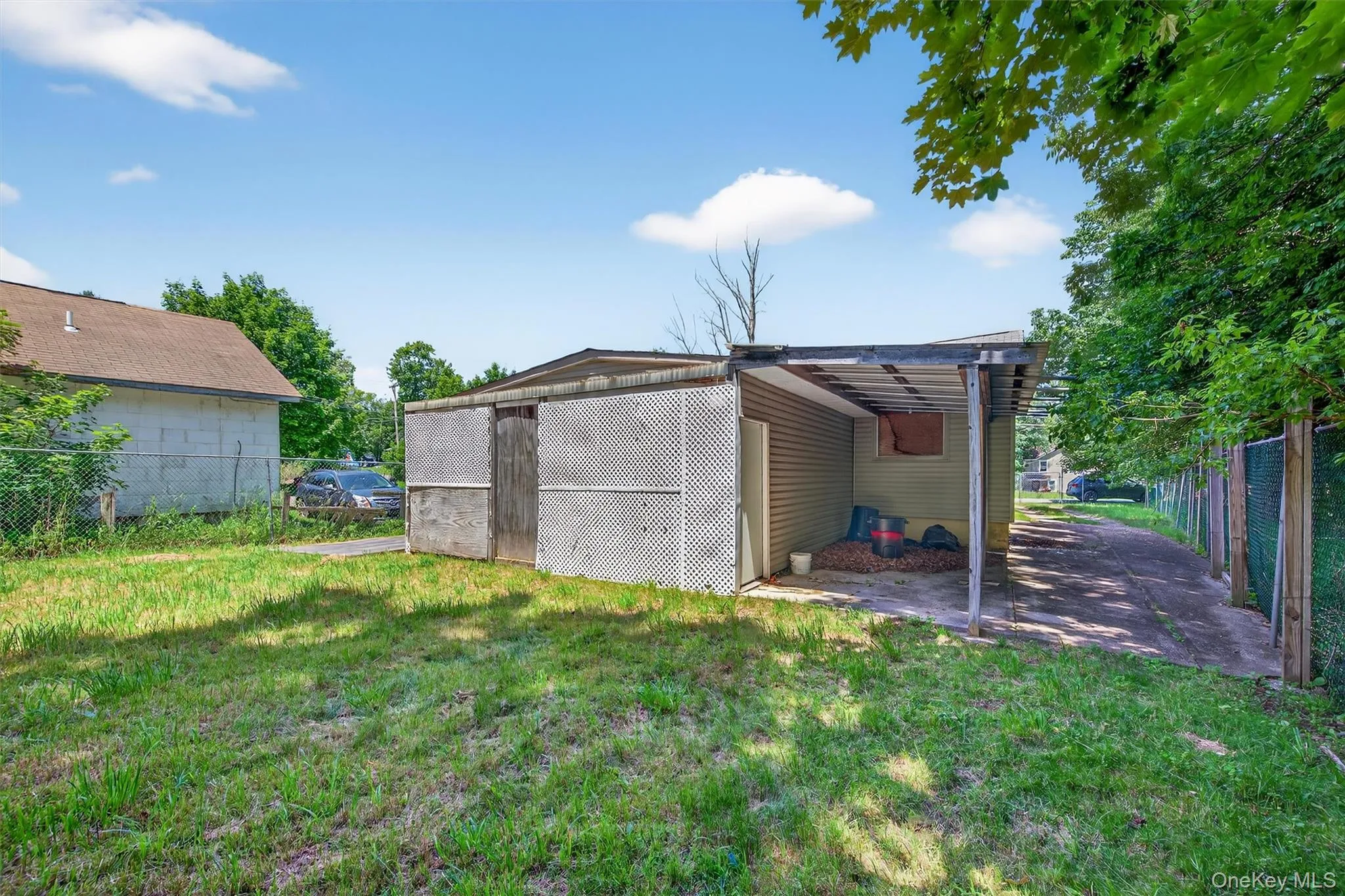View of outbuilding with a carport View of outbuilding with a carport