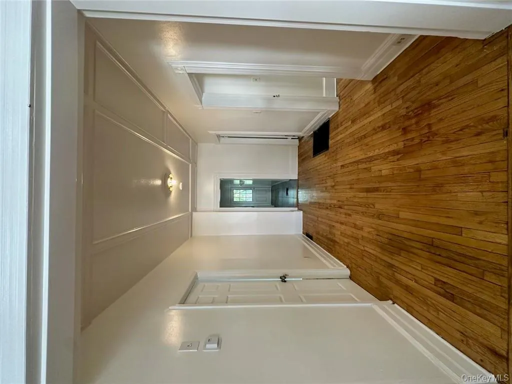 Corridor with hardwood / wood-style floors Corridor with hardwood / wood-style floors
