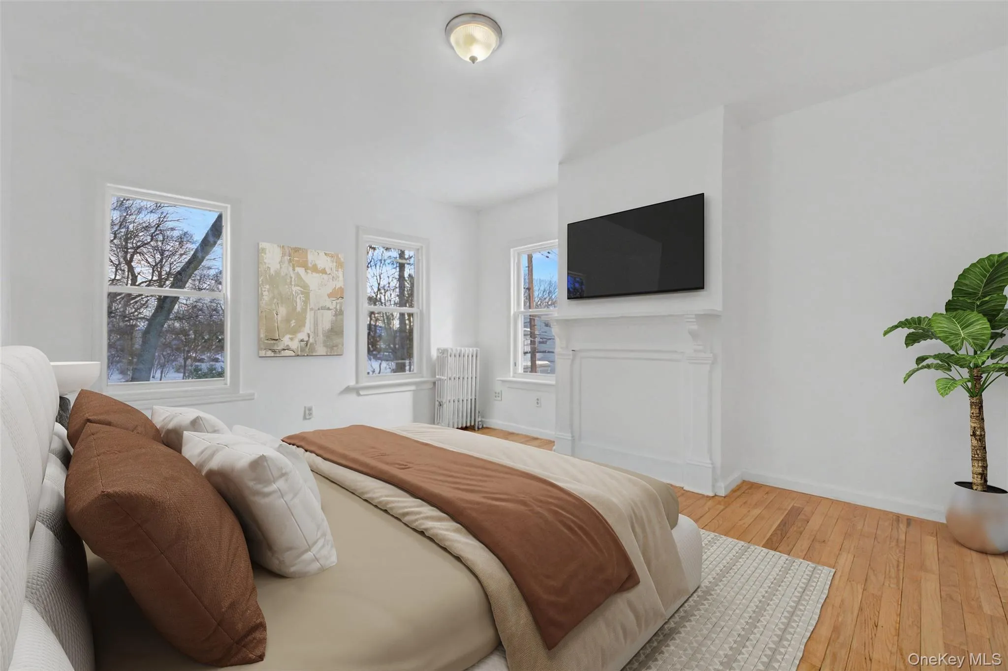 Virtually Staged Light-filled bedroom with classic architectural charm, radiator heat, and ample wall space for furnishings. Virtually Staged Light-filled bedroom with classic architectural charm, radiator heat, and ample wall space for furnishings.