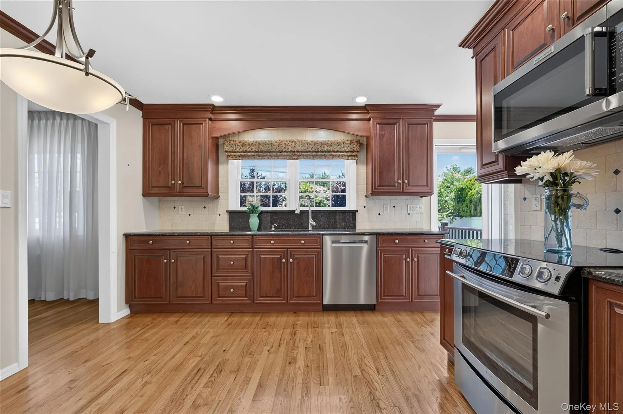 Eat in Kitchen with Hardwood Floor and lots of storage and light Eat in Kitchen with Hardwood Floor and lots of storage and light