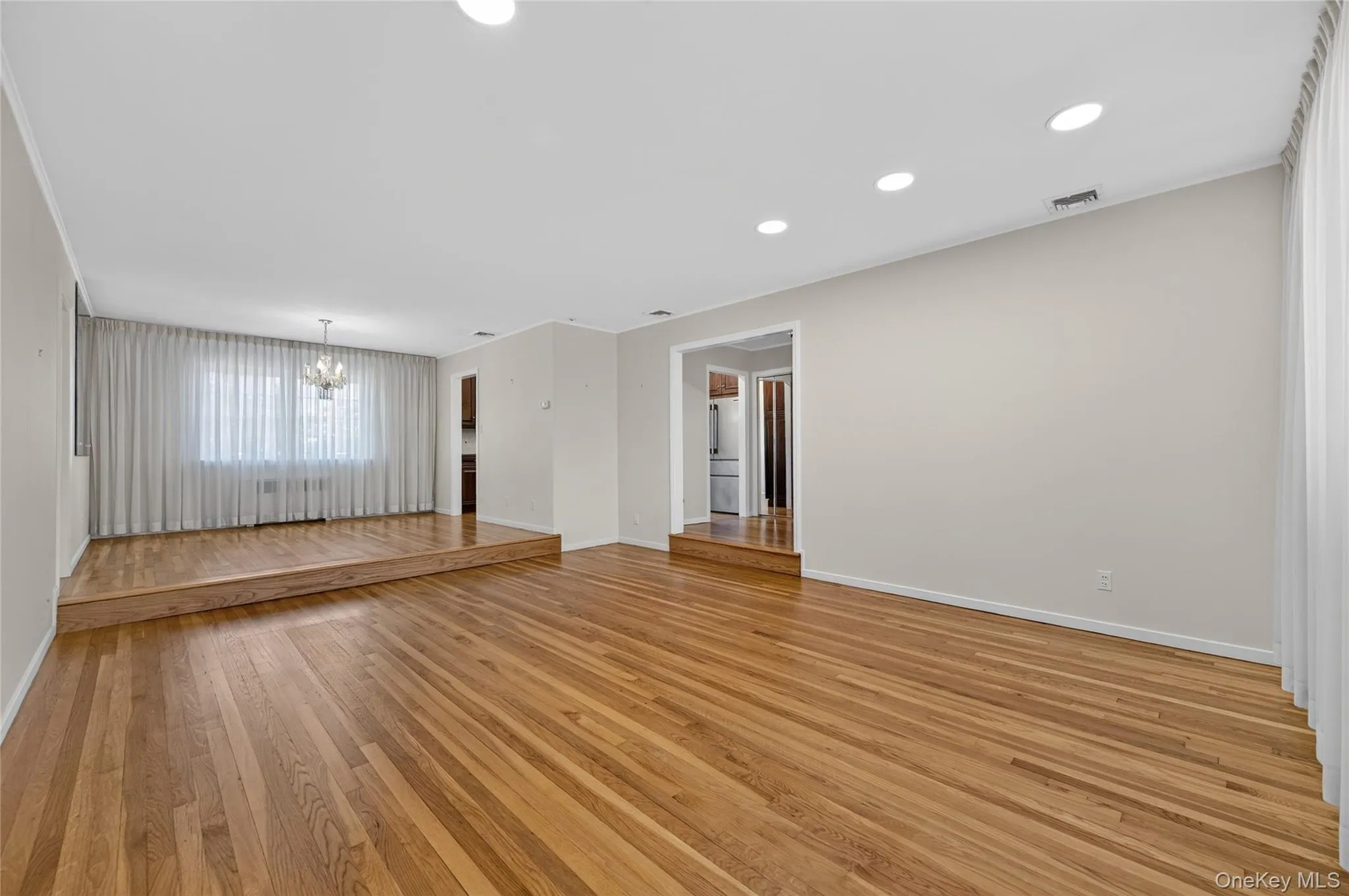 Living Room with Hardwood Floor looking into the Dining Room Living Room with Hardwood Floor looking into the Dining Room