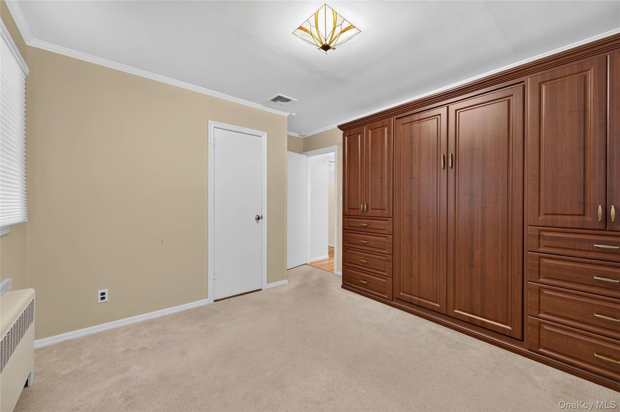 This Bedroom has a new Murphy bed. Hardwood under the carpet This Bedroom has a new Murphy bed. Hardwood under the carpet