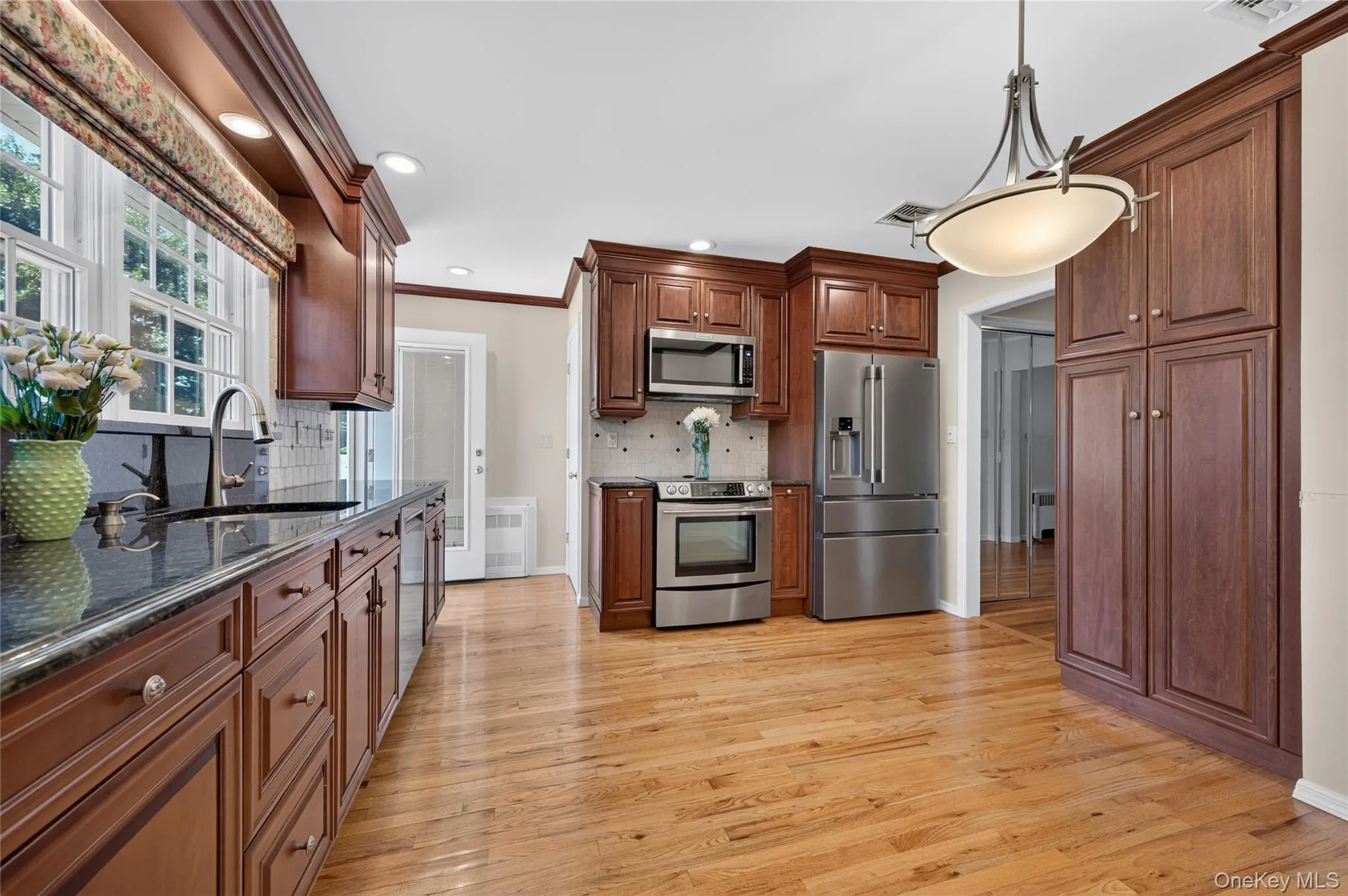 Eat in Kitchen with Hardwood Floor and lots of storage and light Eat in Kitchen with Hardwood Floor and lots of storage and light