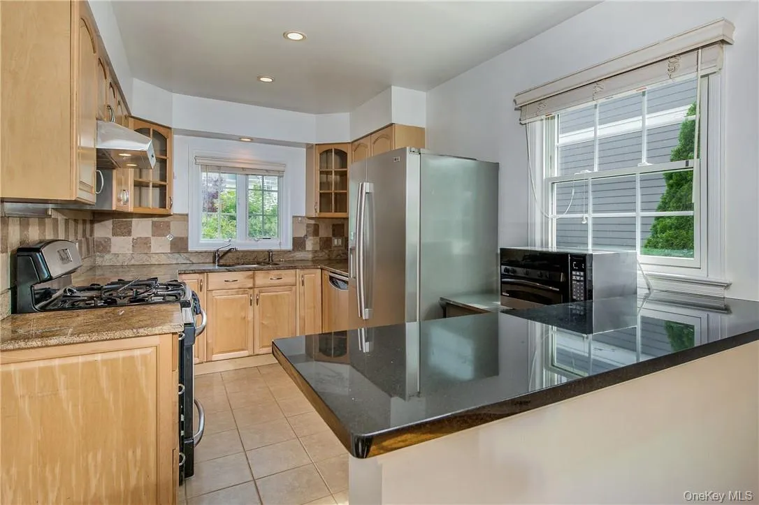 Kitchen with granite countertops and stainless steel applicances Kitchen with granite countertops and stainless steel applicances