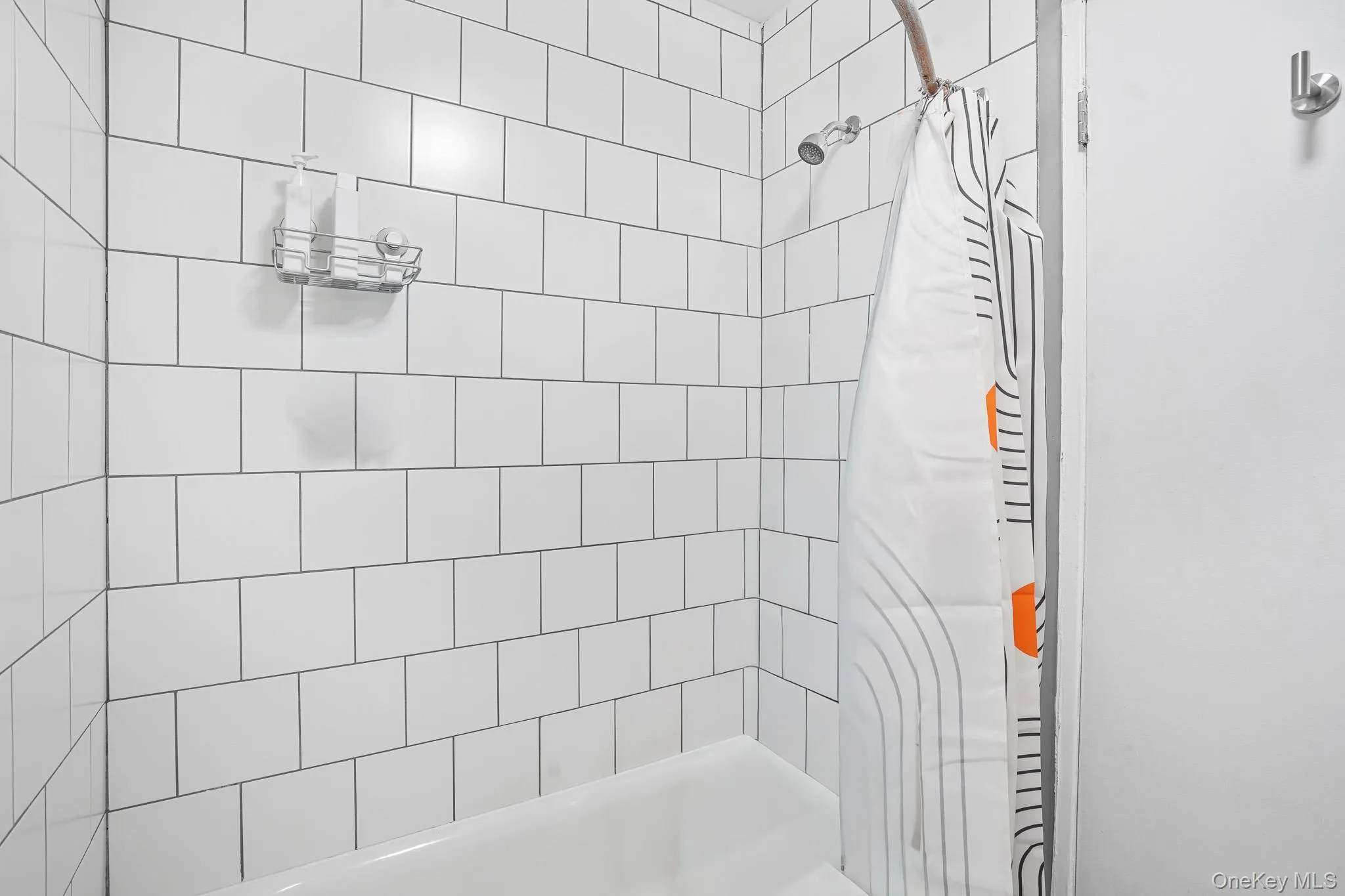 Full bathroom featuring shower / bathtub combination with curtain Full bathroom featuring shower / bathtub combination with curtain