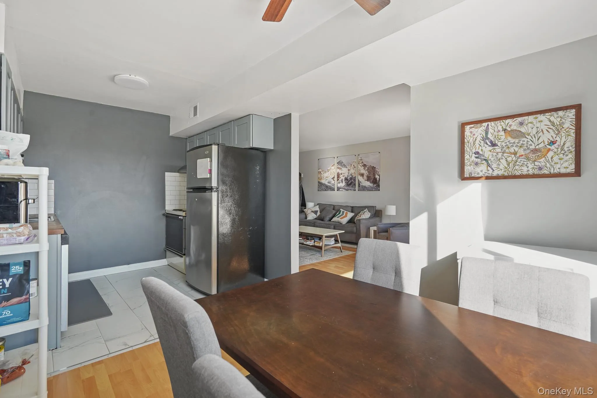 Dining space featuring ceiling fan and light wood-style flooring Dining space featuring ceiling fan and light wood-style flooring