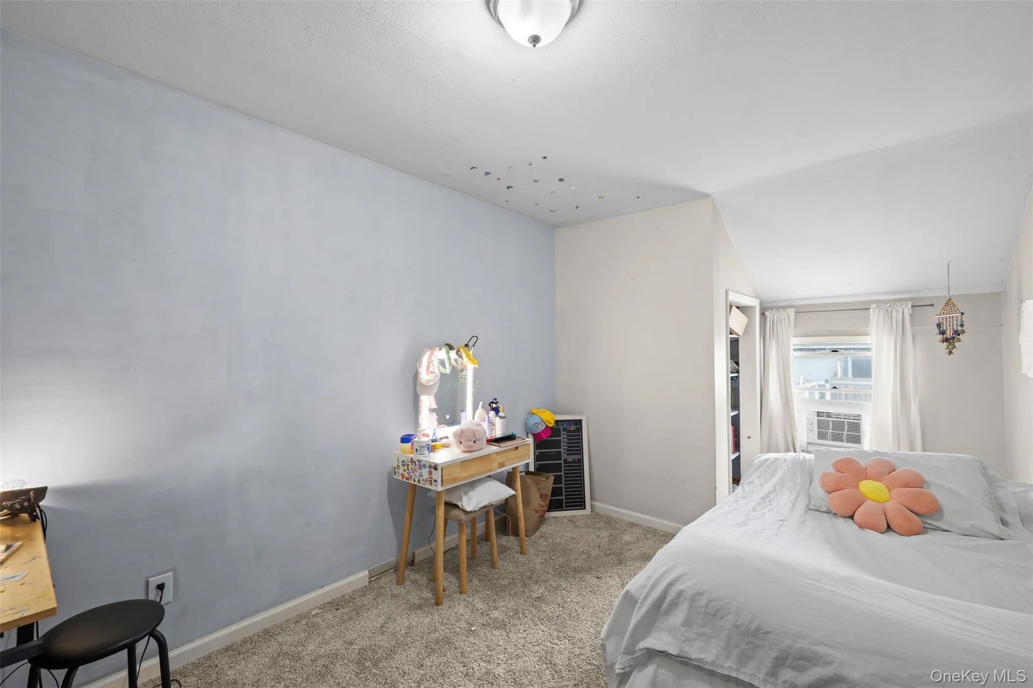 Carpeted bedroom featuring baseboards Carpeted bedroom featuring baseboards