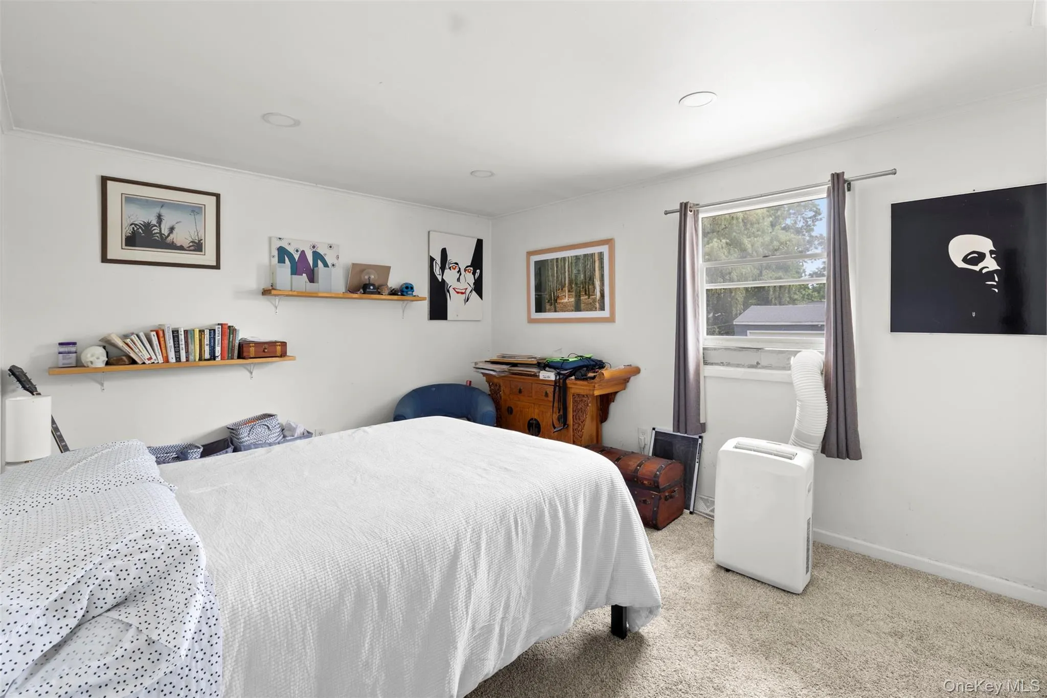 Bedroom featuring carpet flooring and ornamental molding Bedroom featuring carpet flooring and ornamental molding