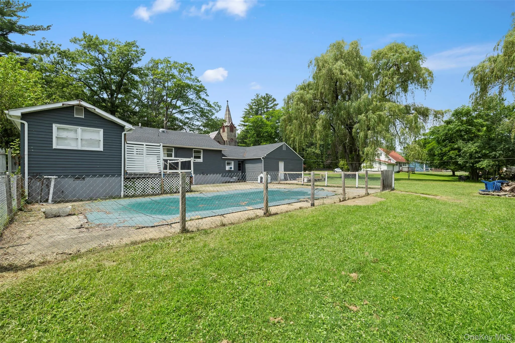 View of swimming pool featuring a fenced backyard View of swimming pool featuring a fenced backyard
