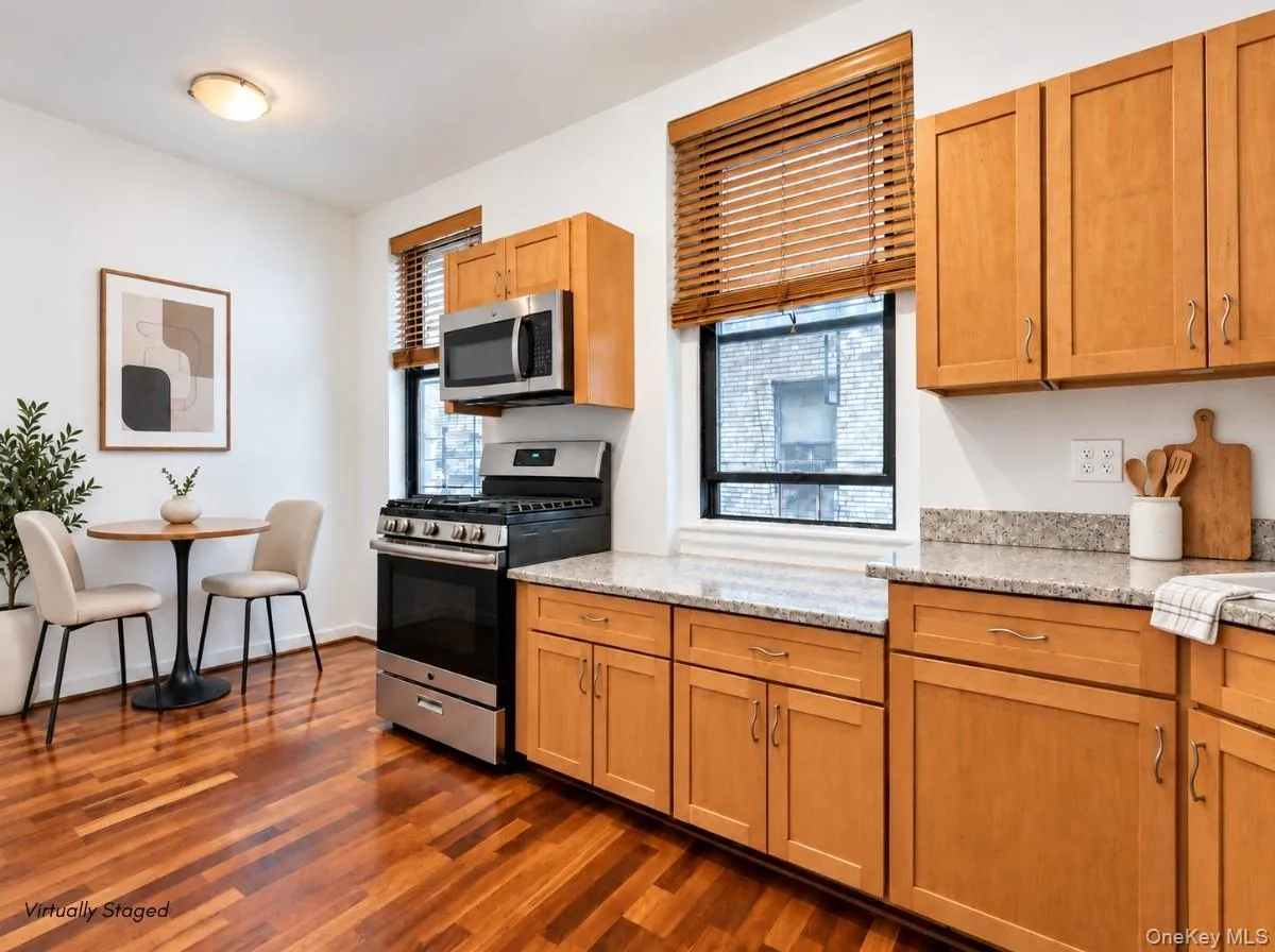 Hardwood flooring, light wood cabinetry, stainless steel appliances, granite countertops, and recessed lighting Hardwood flooring, light wood cabinetry, stainless steel appliances, granite countertops, and recessed lighting