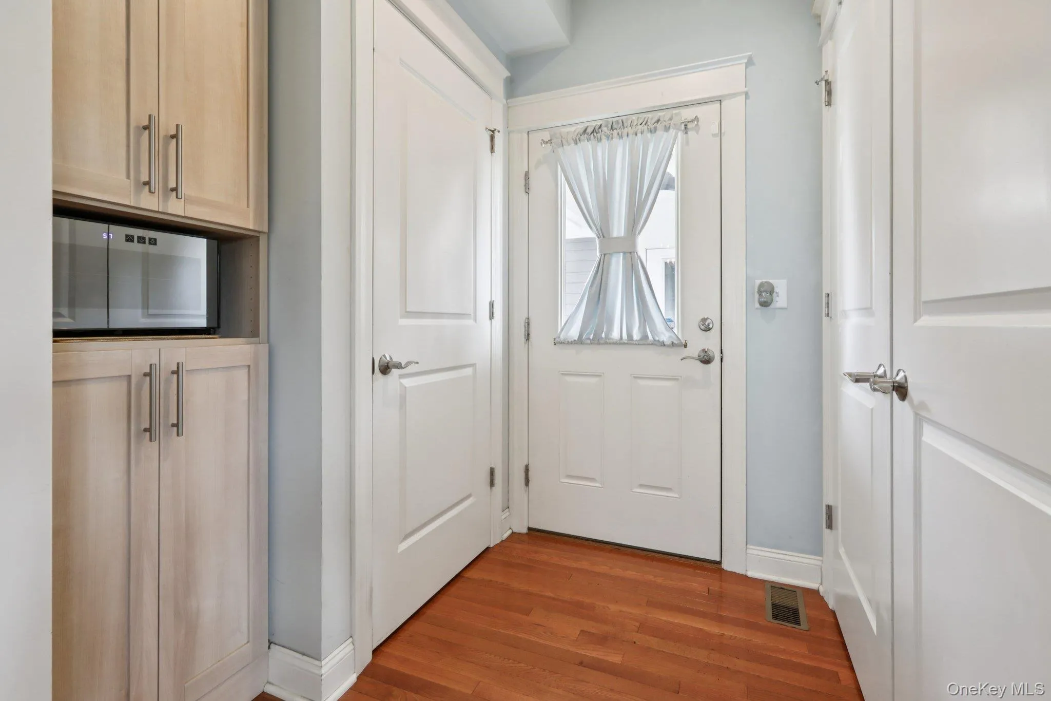 Take this door out to the breezeway.. this space offers more built-in cabinetry for storage and of course, a coat closet Take this door out to the breezeway.. this space offers more built-in cabinetry for storage and of course, a coat closet