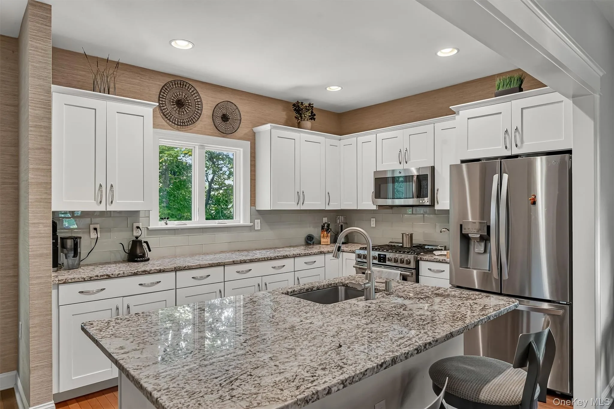 Center island, enhanced with granite and SS appliances, is a chefs delight. Center island, enhanced with granite and SS appliances, is a chefs delight.