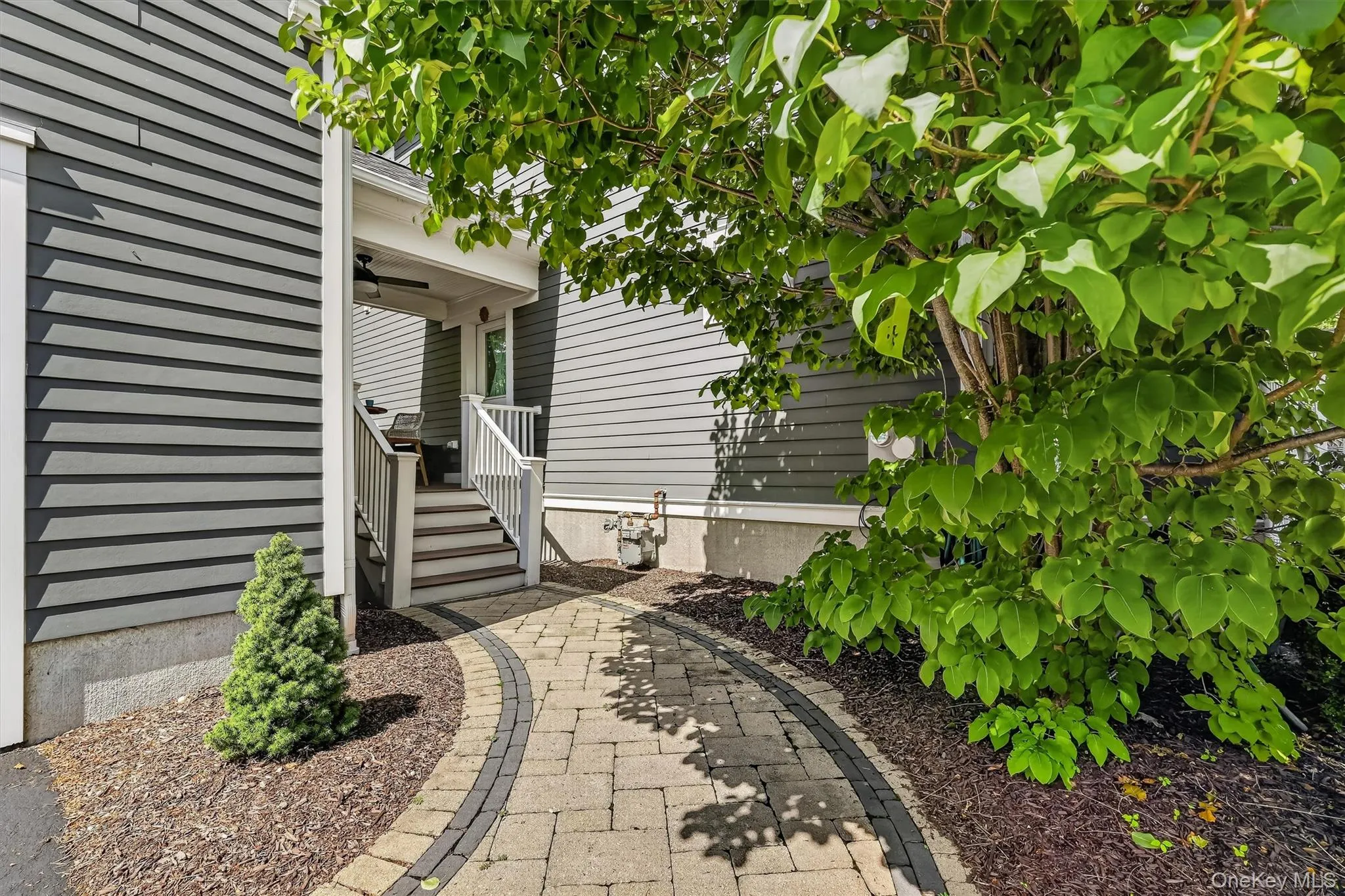 Take this hardscaped pathway to the unique breezeway. Take this hardscaped pathway to the unique breezeway.