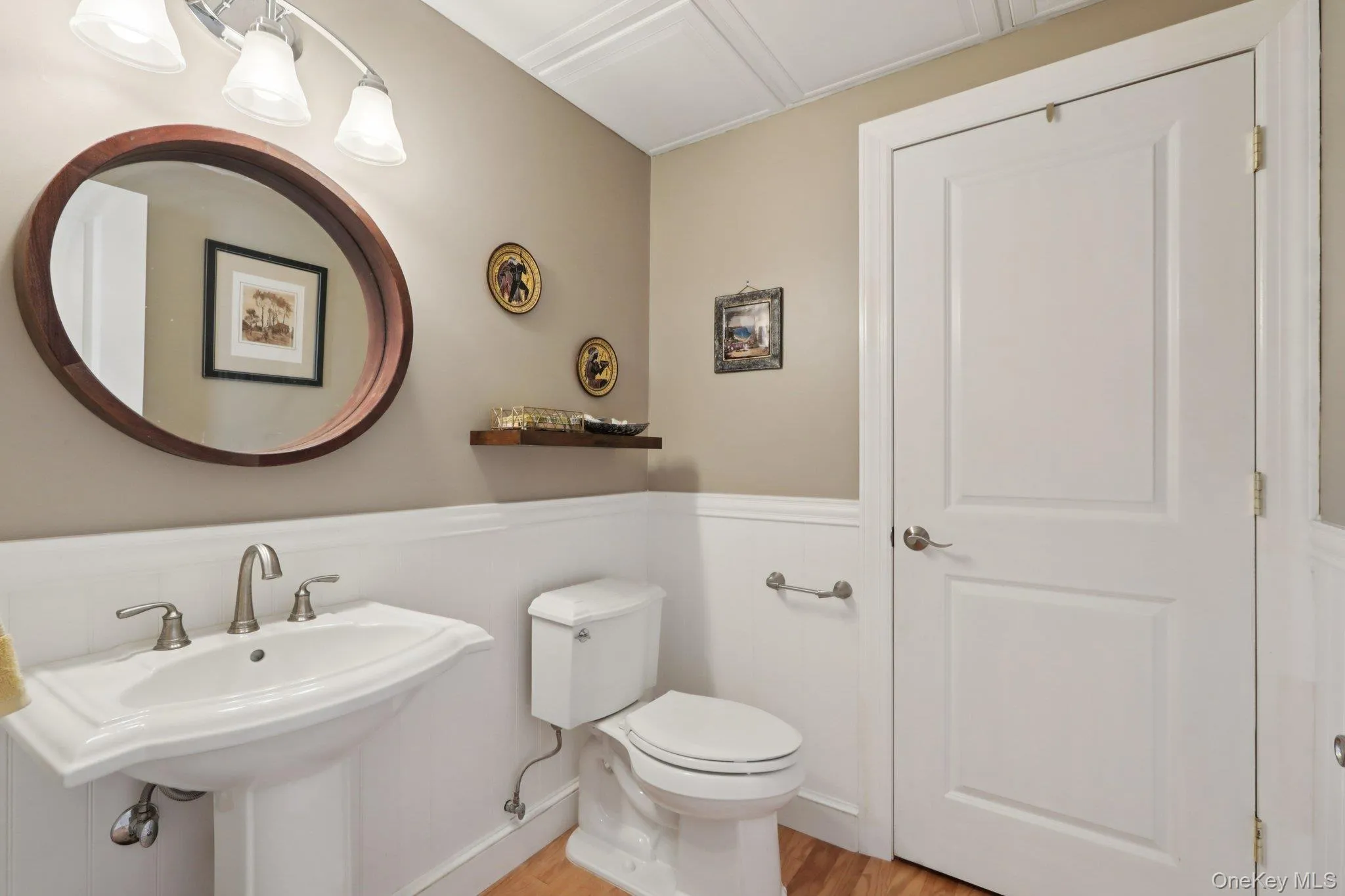 Well-appointed half bath. The door is the second access to the large storage area. Well-appointed half bath. The door is the second access to the large storage area.