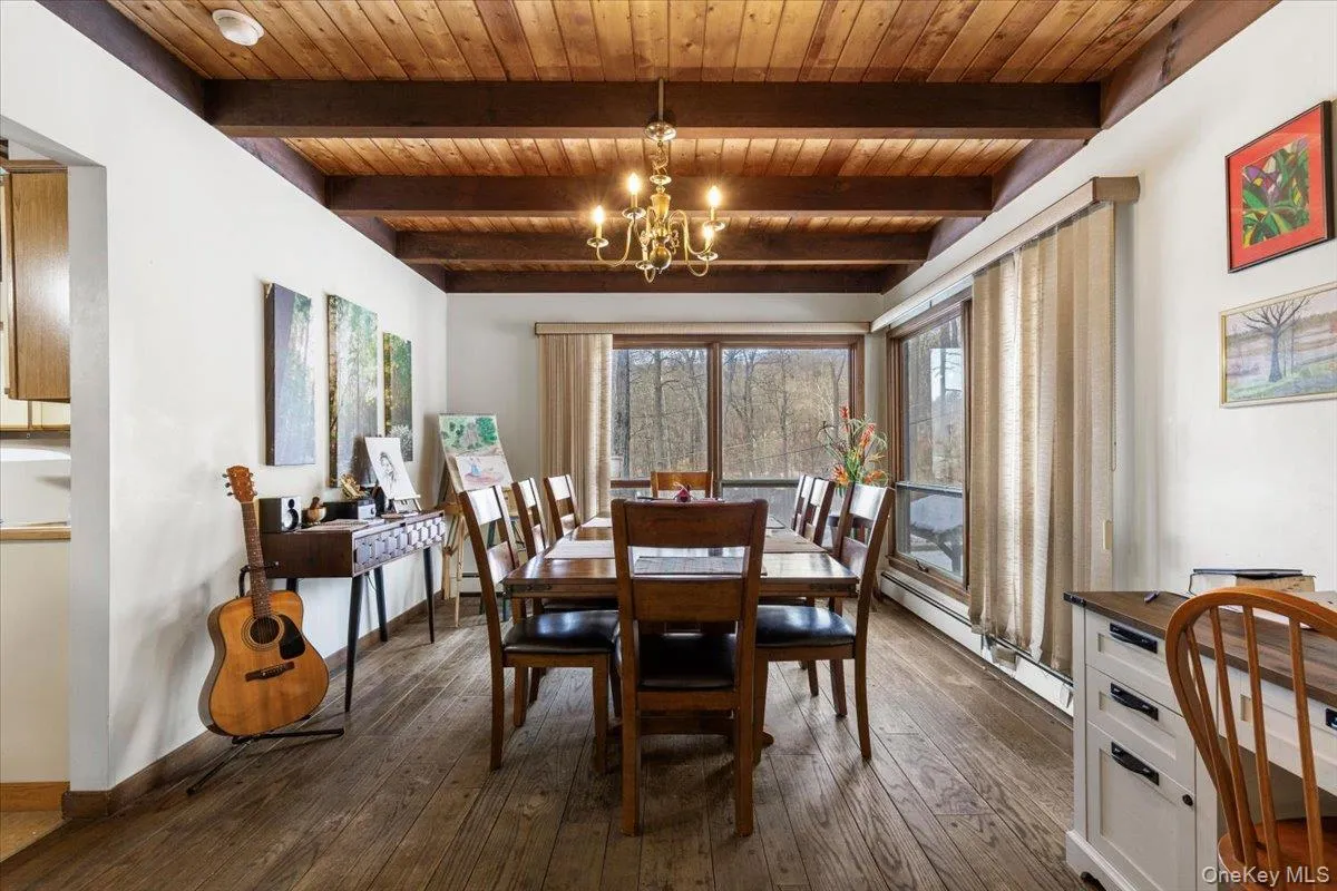Dining Area – Open dining space with sliding doors to outdoor deck. Dining Area – Open dining space with sliding doors to outdoor deck.
