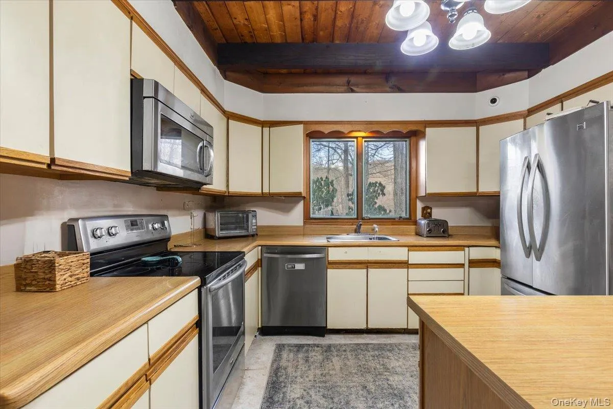Kitchen Alternate View – Functional layout with stainless appliances and natural light. Kitchen Alternate View – Functional layout with stainless appliances and natural light.