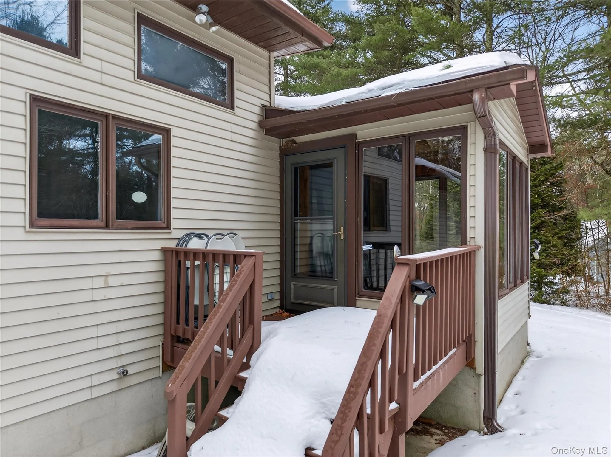 Back deck off sunroom out to backyard. Back deck off sunroom out to backyard.