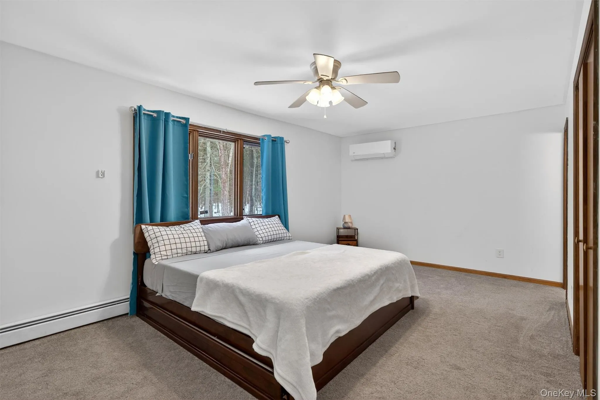 Bedroom featuring carpet and ceiling fan Bedroom featuring carpet and ceiling fan