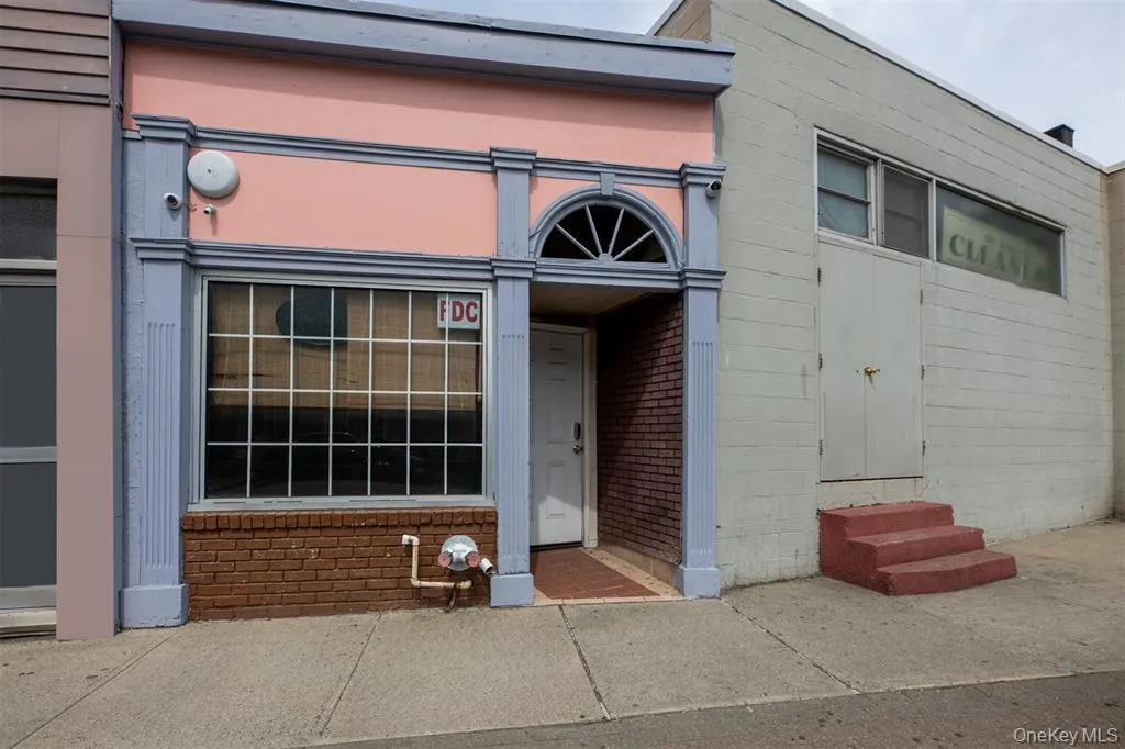 Property entrance with brick siding Property entrance with brick siding