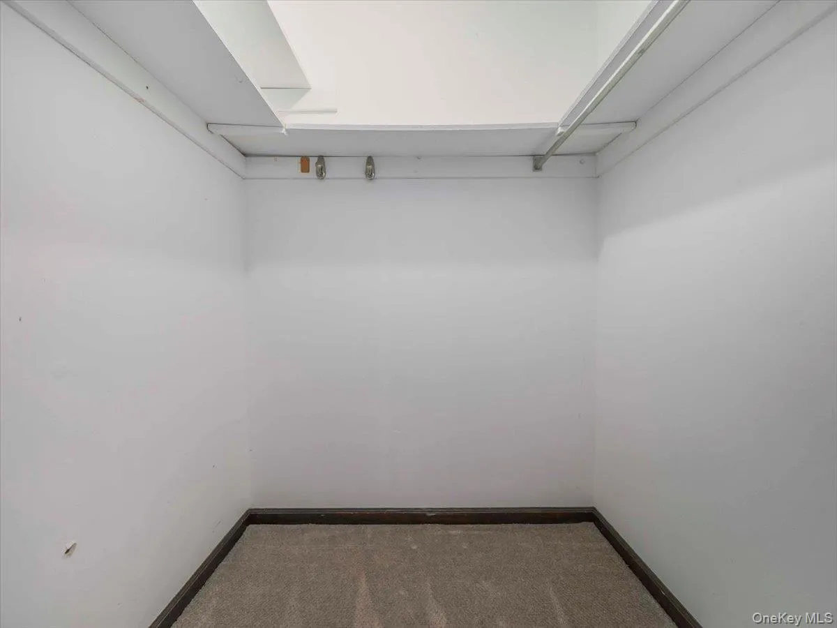 Walk in closet in primary bedroom Walk in closet in primary bedroom