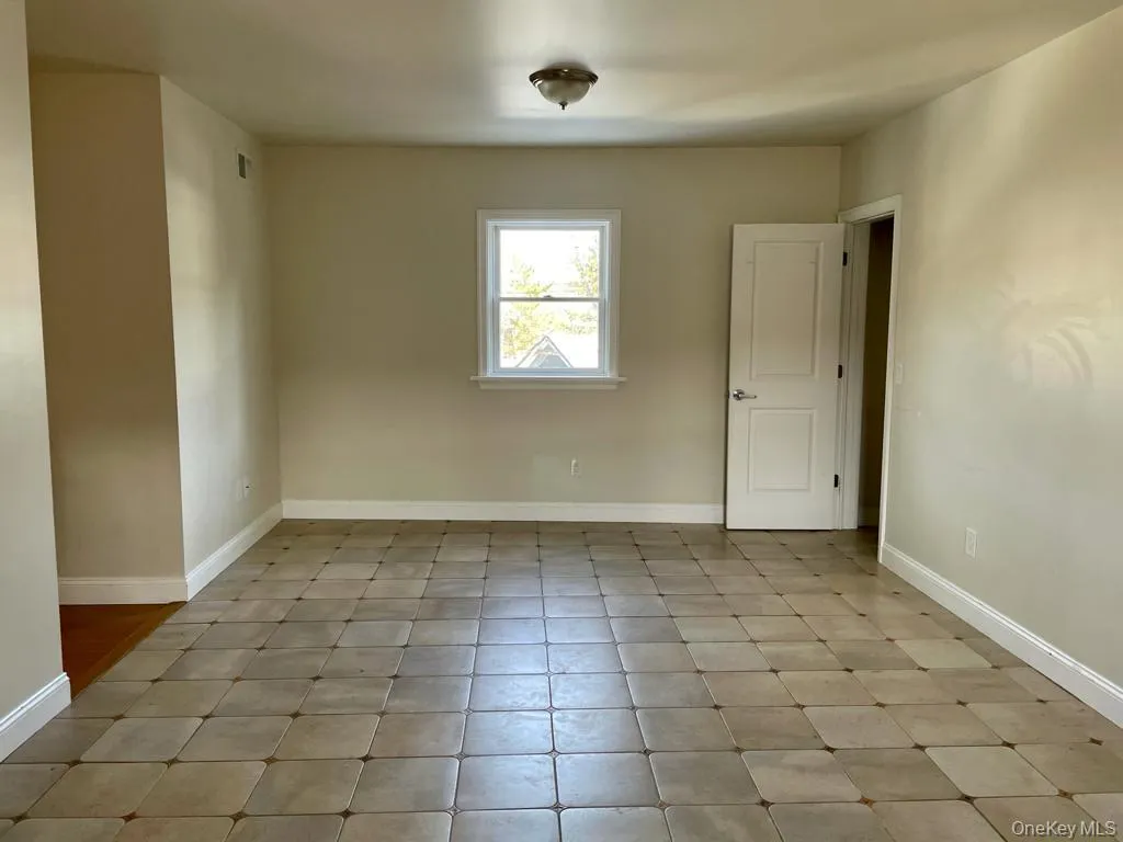 Large living/dining area with imported stone tile Large living/dining area with imported stone tile