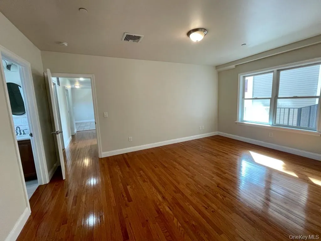 Brigh bedroom with lovely wood floors Brigh bedroom with lovely wood floors