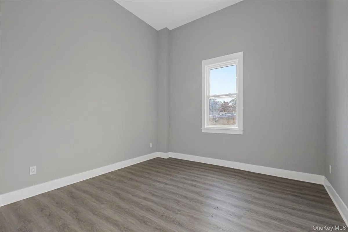 Bedroom – Bright bedroom with oversized window, high ceilings, and generous wall space. Bedroom – Bright bedroom with oversized window, high ceilings, and generous wall space.
