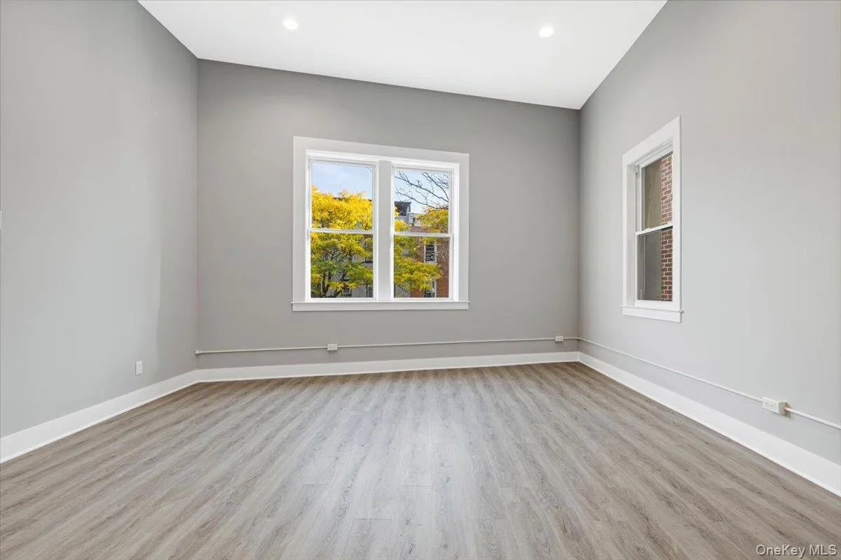 Bedroom – Bright bedroom with oversized window, high ceilings, and generous wall space. Bedroom – Bright bedroom with oversized window, high ceilings, and generous wall space.