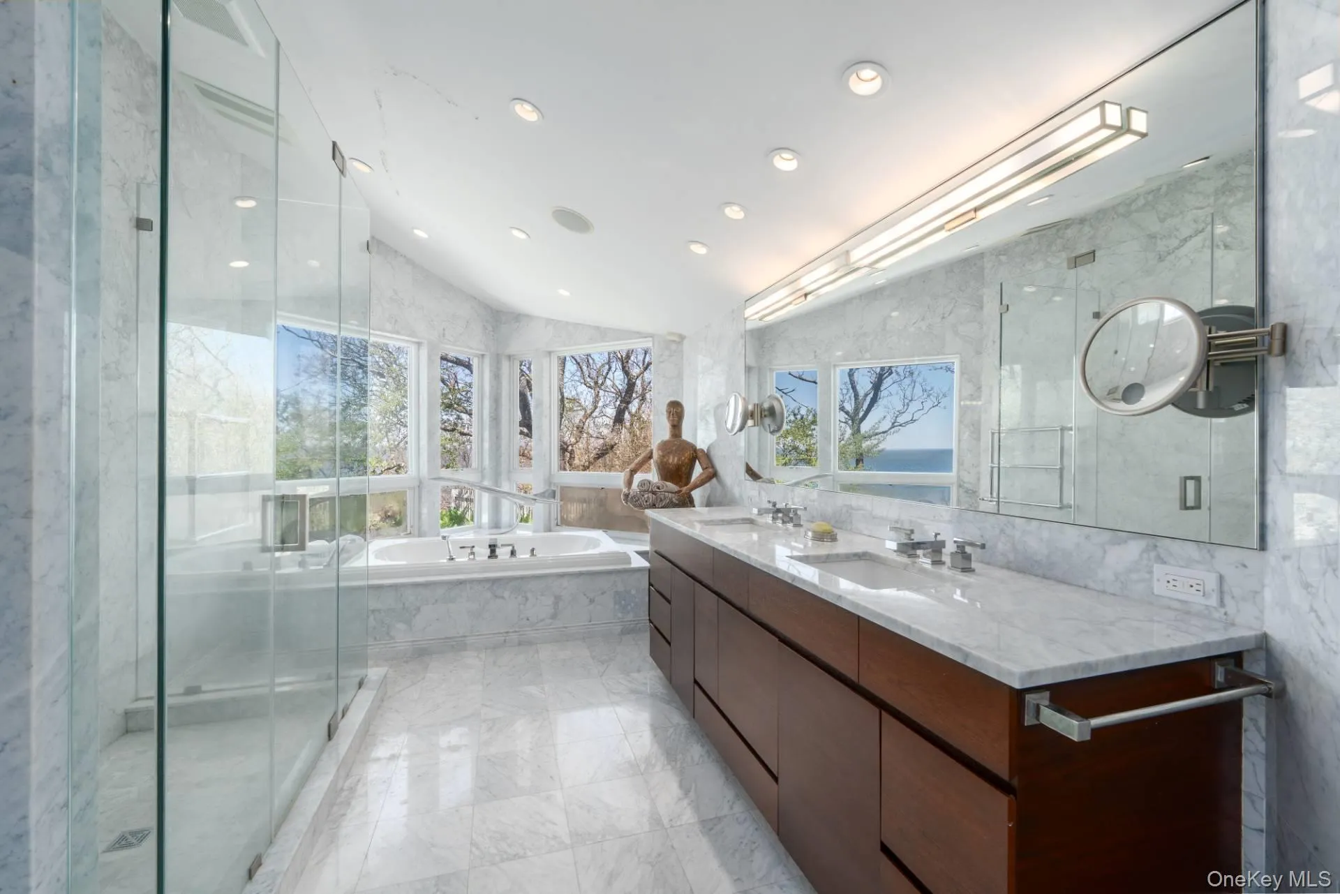Primary suite luxurious bath with white Italian marble Primary suite luxurious bath with white Italian marble