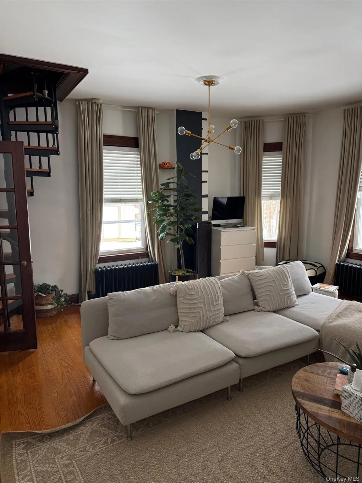 Living Room with Spiral Staircase to upstairs Bedroom Living Room with Spiral Staircase to upstairs Bedroom