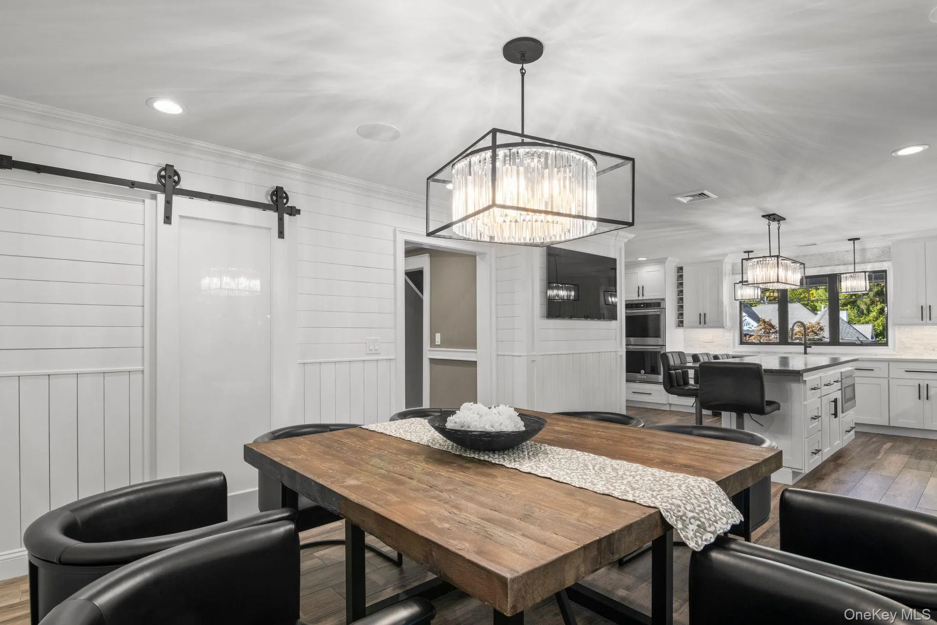 Dining room with a butler's pantry behind a barn door Dining room with a butler's pantry behind a barn door