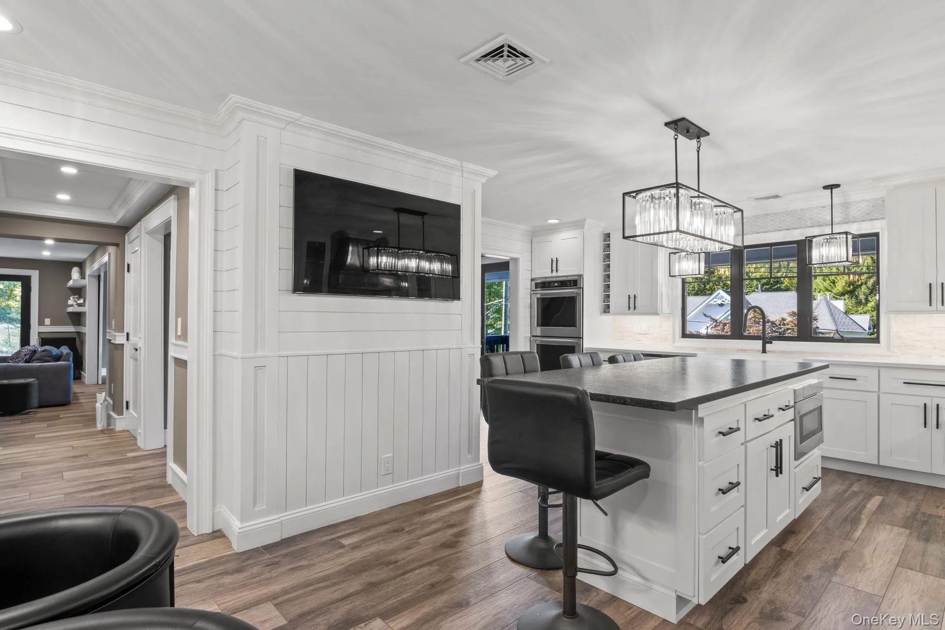 Kitchen features center island with micowave and storage and Shiplap walls Kitchen features center island with micowave and storage and Shiplap walls