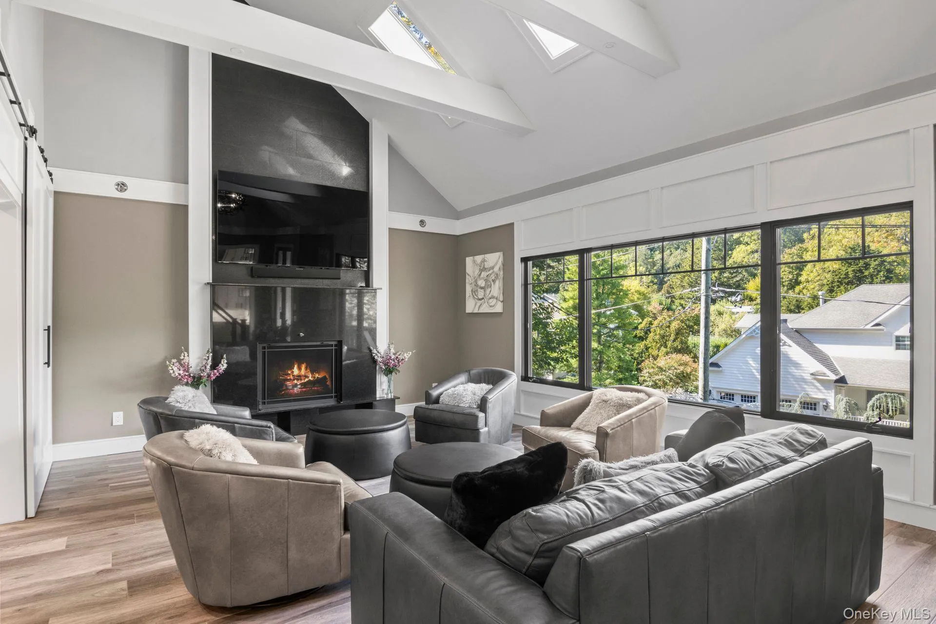 Living Room with panoramic windows and wood burning fireplace Living Room with panoramic windows and wood burning fireplace