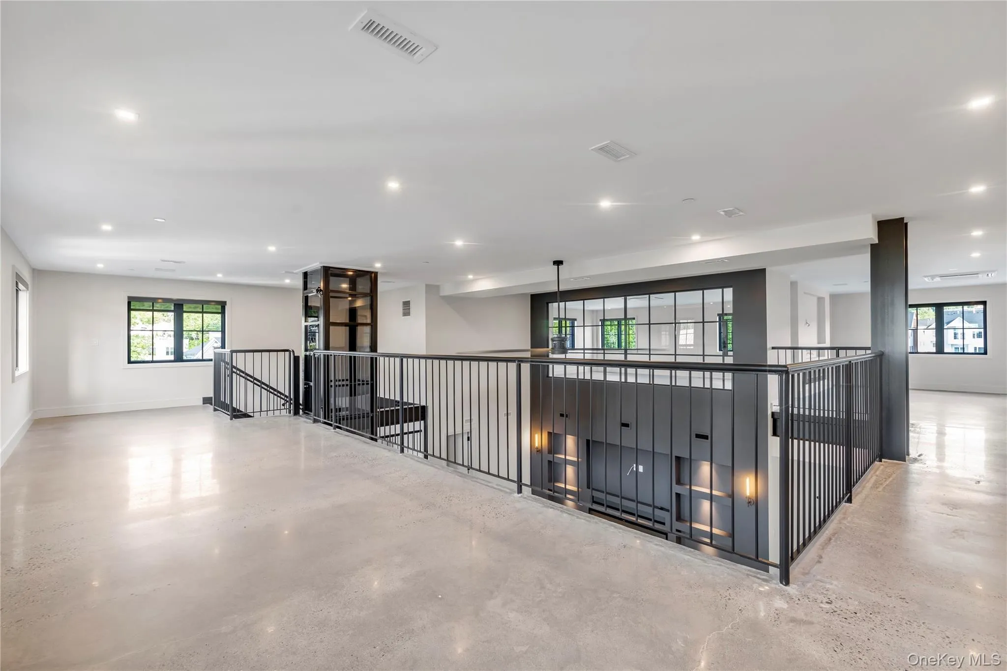 Upper level with poured concrete flooring, cast iron railings, Upper level with poured concrete flooring, cast iron railings,