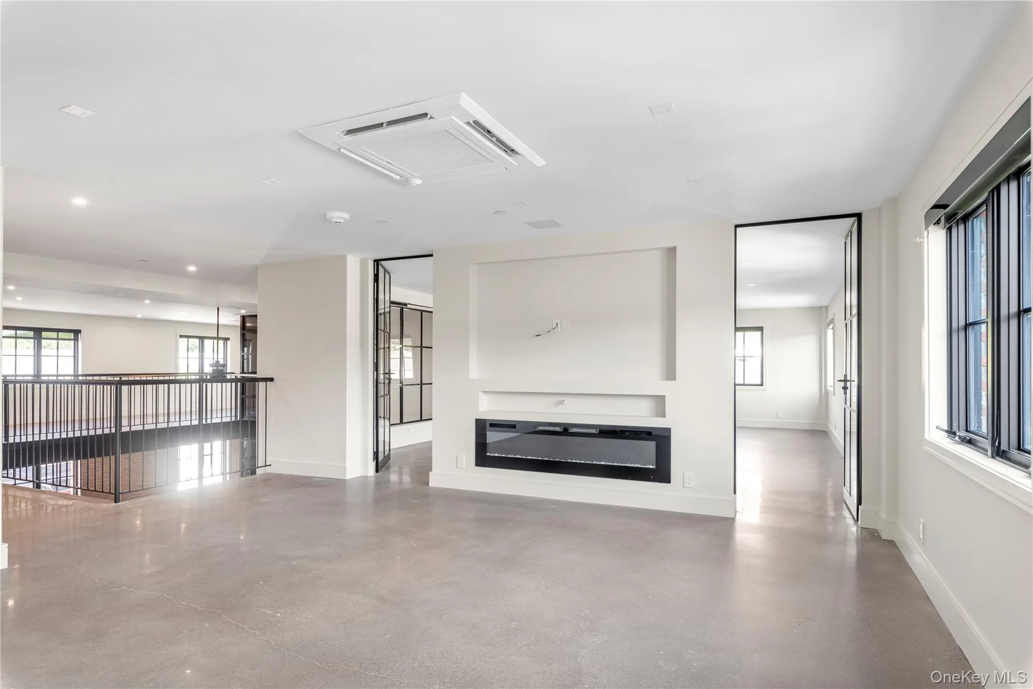 Upper level den/sitting room/home office with second electric fireplace and healthy amount of natural light Upper level den/sitting room/home office with second electric fireplace and healthy amount of natural light