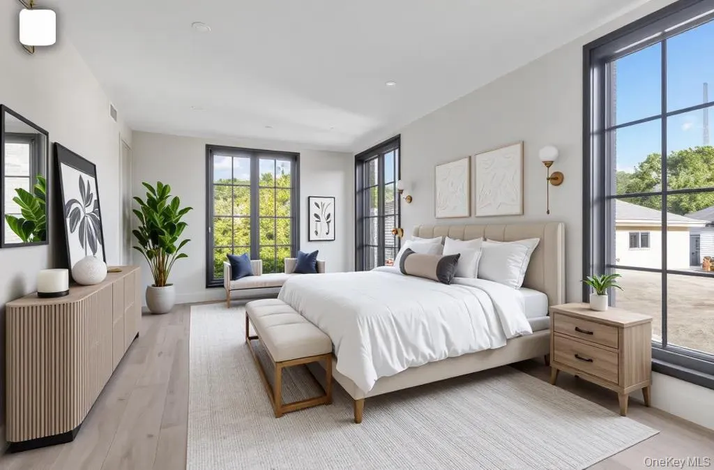 Bedroom featuring light wood-style floors and recessed lighting Bedroom featuring light wood-style floors and recessed lighting