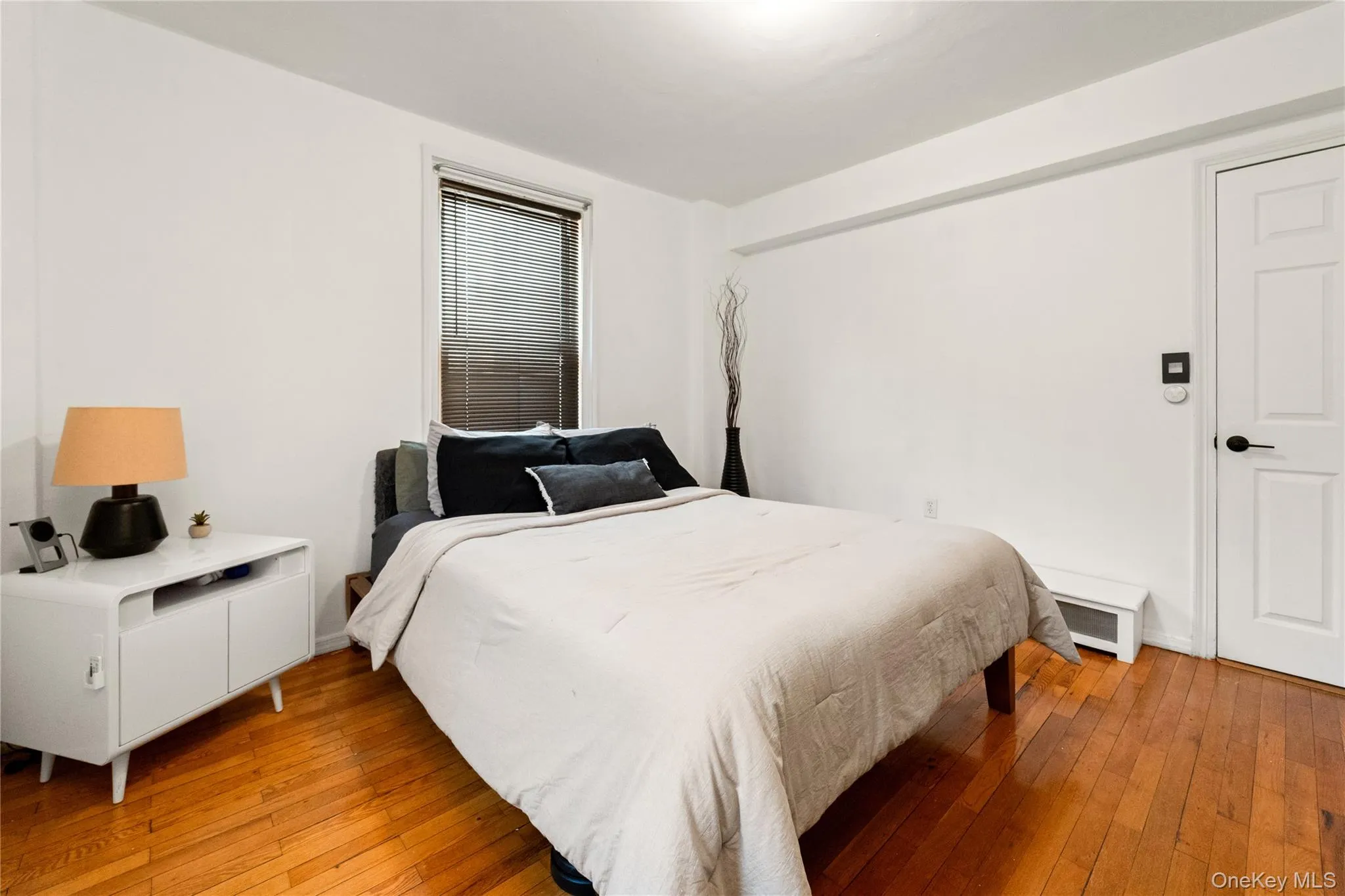 Bedroom with hardwood / wood-style flooring Bedroom with hardwood / wood-style flooring