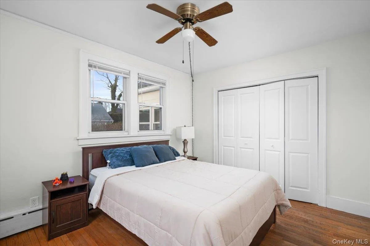 Bedroom #1 on first floor with a fan, and a double closet Bedroom #1 on first floor with a fan, and a double closet