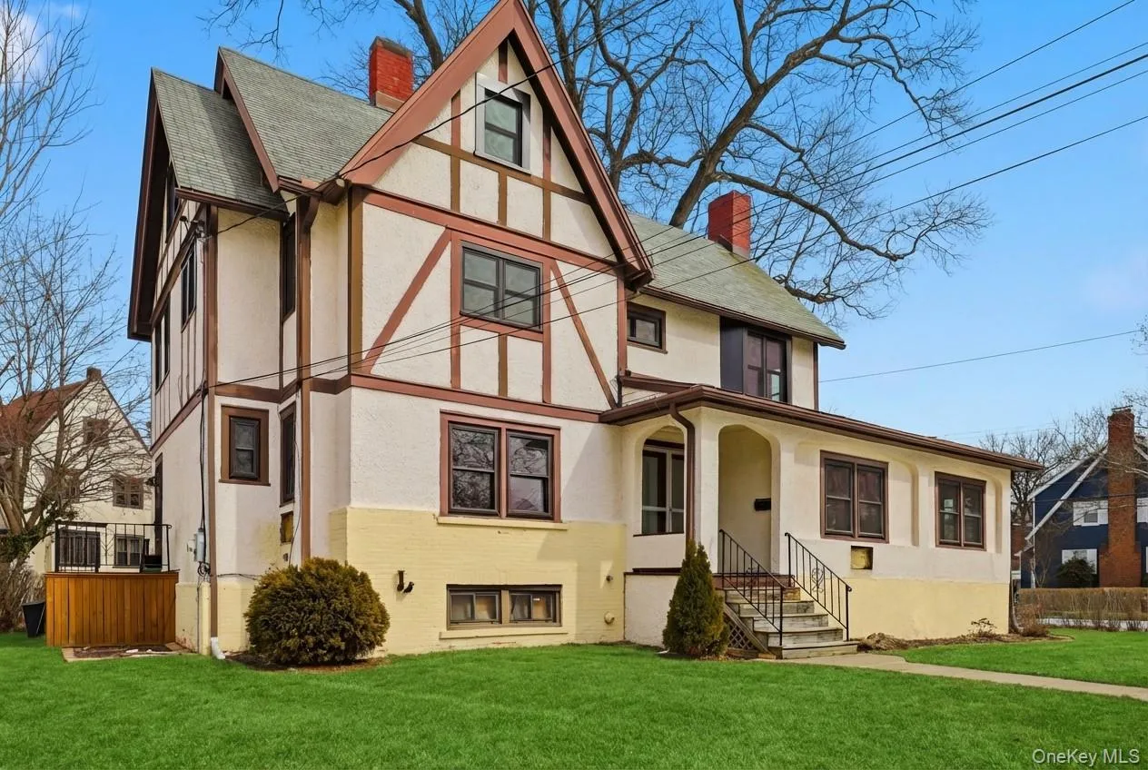 Stately Tudor home rich in timeless character and original details, gracefully positioned on a prominent corner lot Stately Tudor home rich in timeless character and original details, gracefully positioned on a prominent corner lot