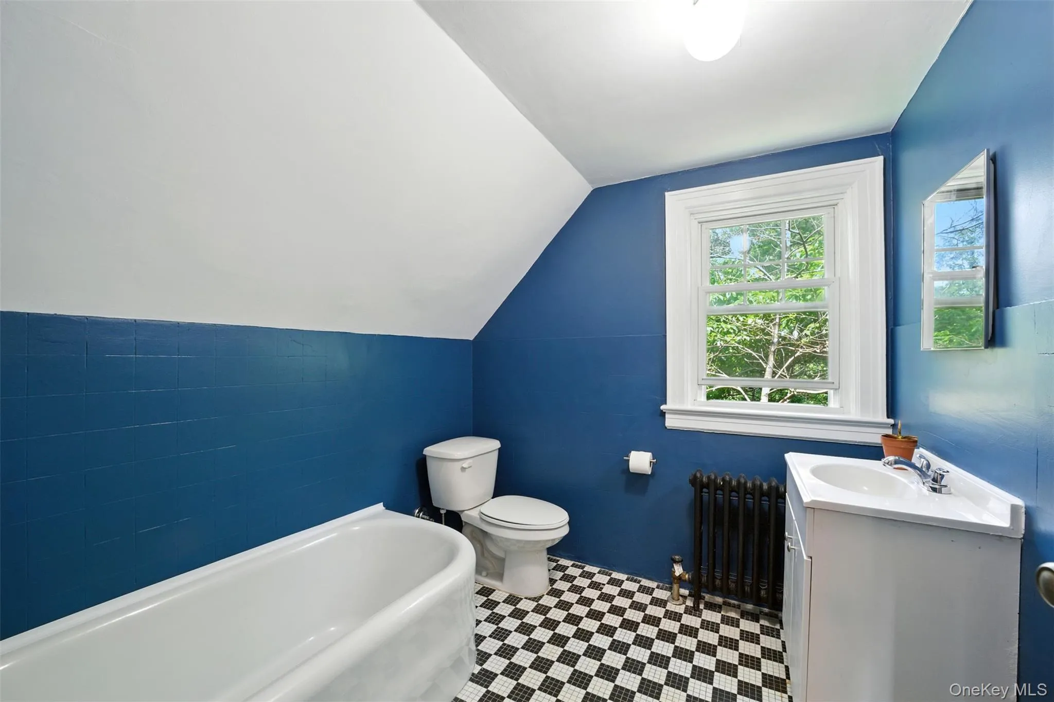3rd Full Bathroom with vaulted ceiling, and tile patterned floors 3rd Full Bathroom with vaulted ceiling, and tile patterned floors