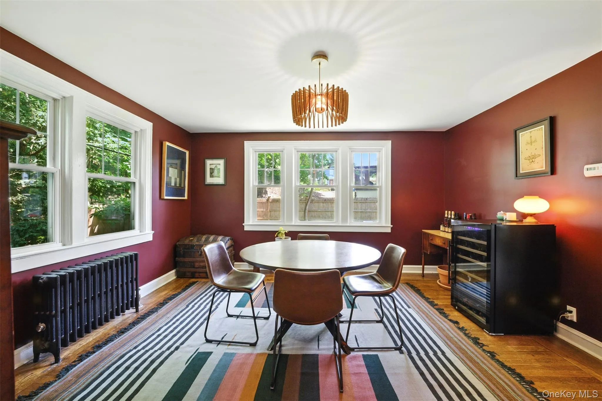 Dining area featuring a chandelier, and wood finished floors Dining area featuring a chandelier, and wood finished floors