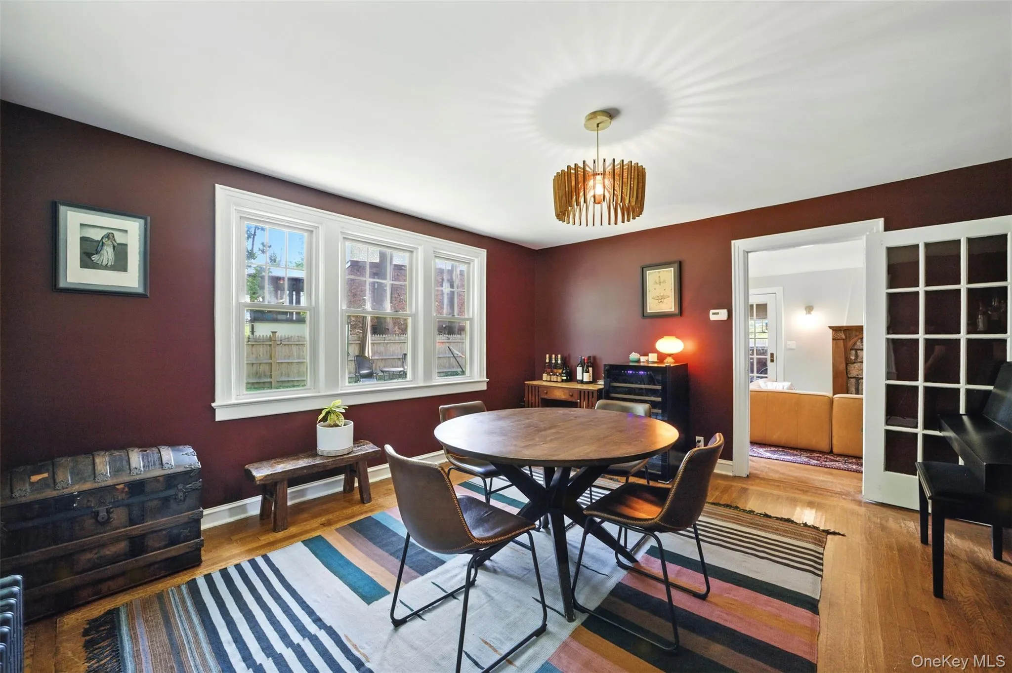 Dining room featuring wood finished floors and a chandelier Dining room featuring wood finished floors and a chandelier