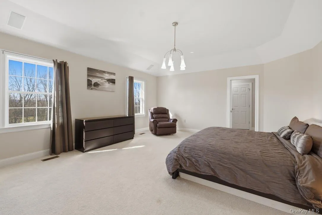 The primary bedroom suite is a private sanctuary. Wall-to-wall carpet, walk-in closet plus 2 additional closets, and private bath. The primary bedroom suite is a private sanctuary. Wall-to-wall carpet, walk-in closet plus 2 additional closets, and private bath.