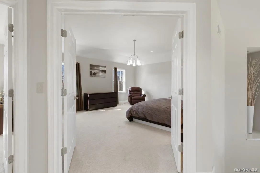 Double door entry to the primary bedroom suite Double door entry to the primary bedroom suite