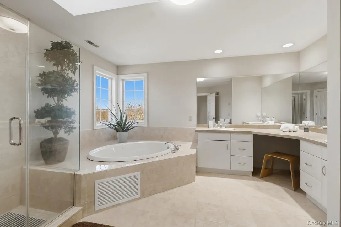Your primary bathroom with walk-in shower, large double-sink vanity, and jetted tub ~ feel like you're in a spa every day. Your primary bathroom with walk-in shower, large double-sink vanity, and jetted tub ~ feel like you're in a spa every day.