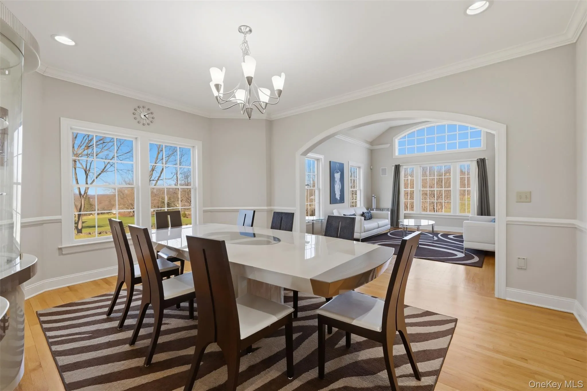 The formal dining and living room blend together for seamless entertaining. The formal dining and living room blend together for seamless entertaining.