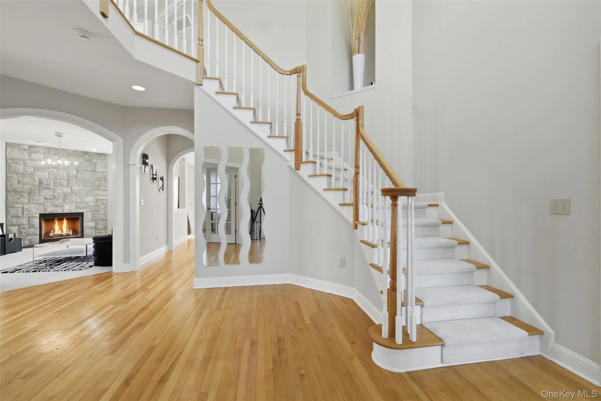 A welcoming entrance foyer with sweeping staircase opens to second floor. A welcoming entrance foyer with sweeping staircase opens to second floor.