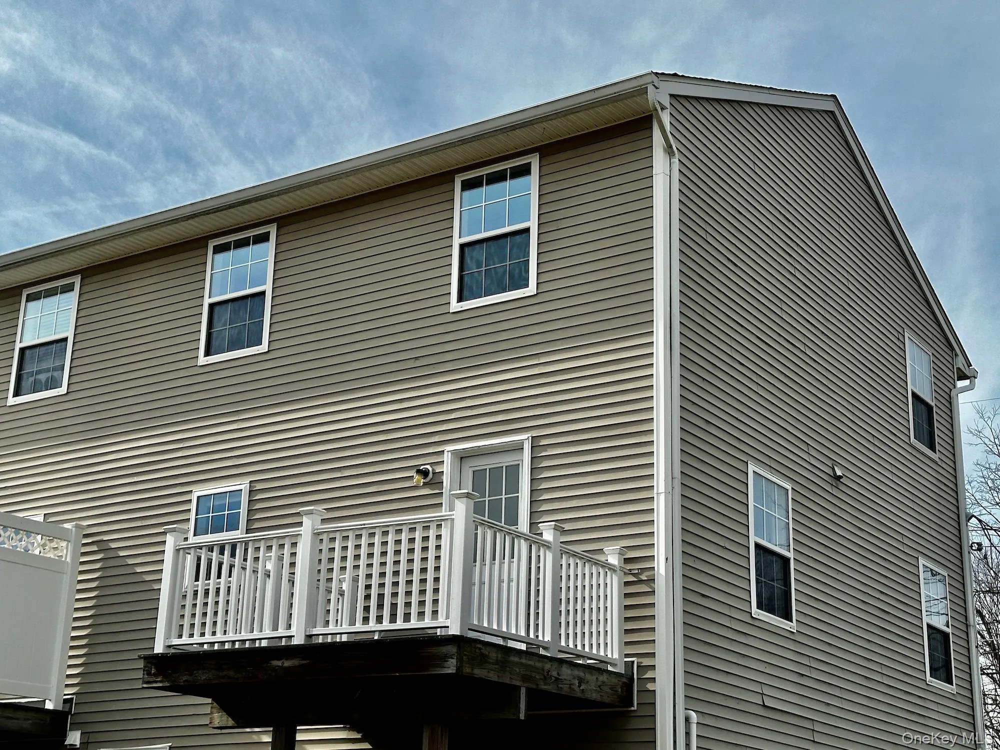 Rear view of house featuring a deck Rear view of house featuring a deck
