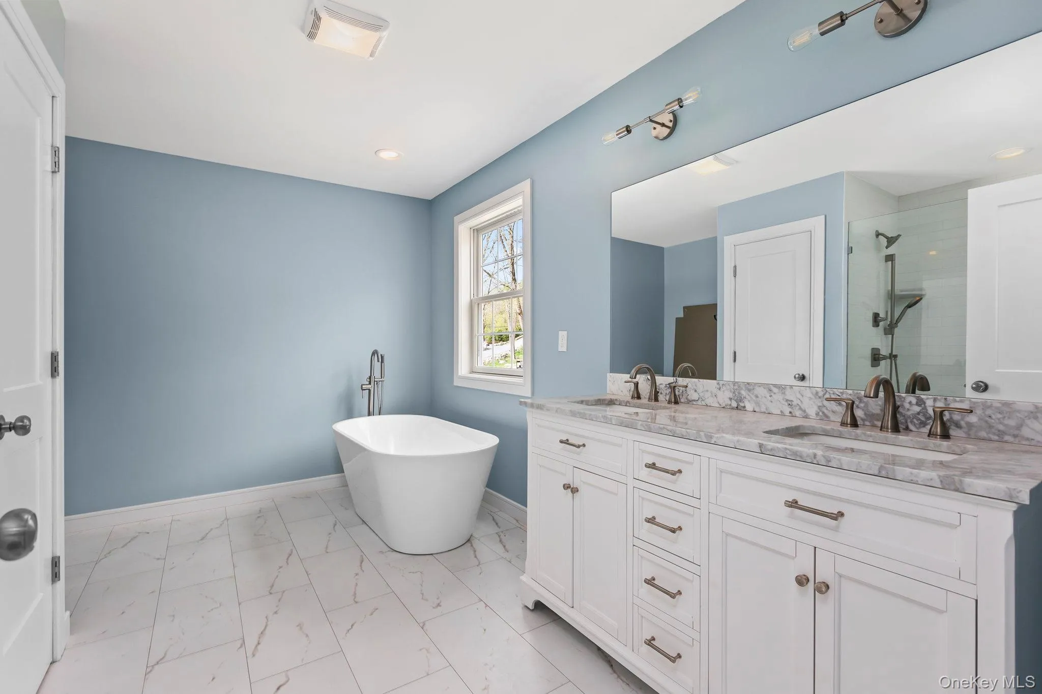 Photo depicts bathroom completed for sister house. Primary will include dual vanities, stand alone tub and separate glass shower. Finishes can vary from sister house photo. Set allowance for bathroom will be given by seller. Photo depicts bathroom completed for sister house. Primary will include dual vanities, stand alone tub and separate glass shower. Finishes can vary from sister house photo. Set allowance for bathroom will be given by seller.