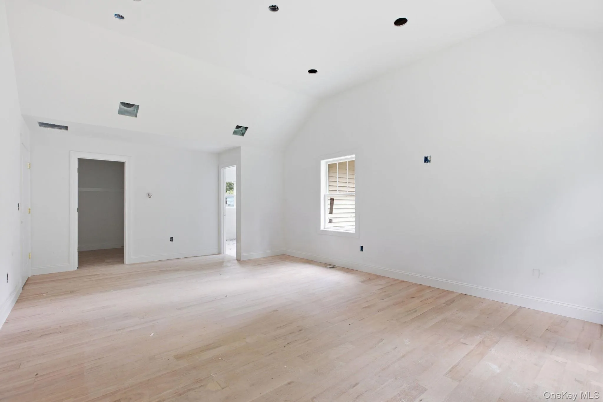 Serene primary bedroom enhanced by recessed lighting and the privacy of an en-suite bath, creating a comfortable retreat at the end of the day. Serene primary bedroom enhanced by recessed lighting and the privacy of an en-suite bath, creating a comfortable retreat at the end of the day.